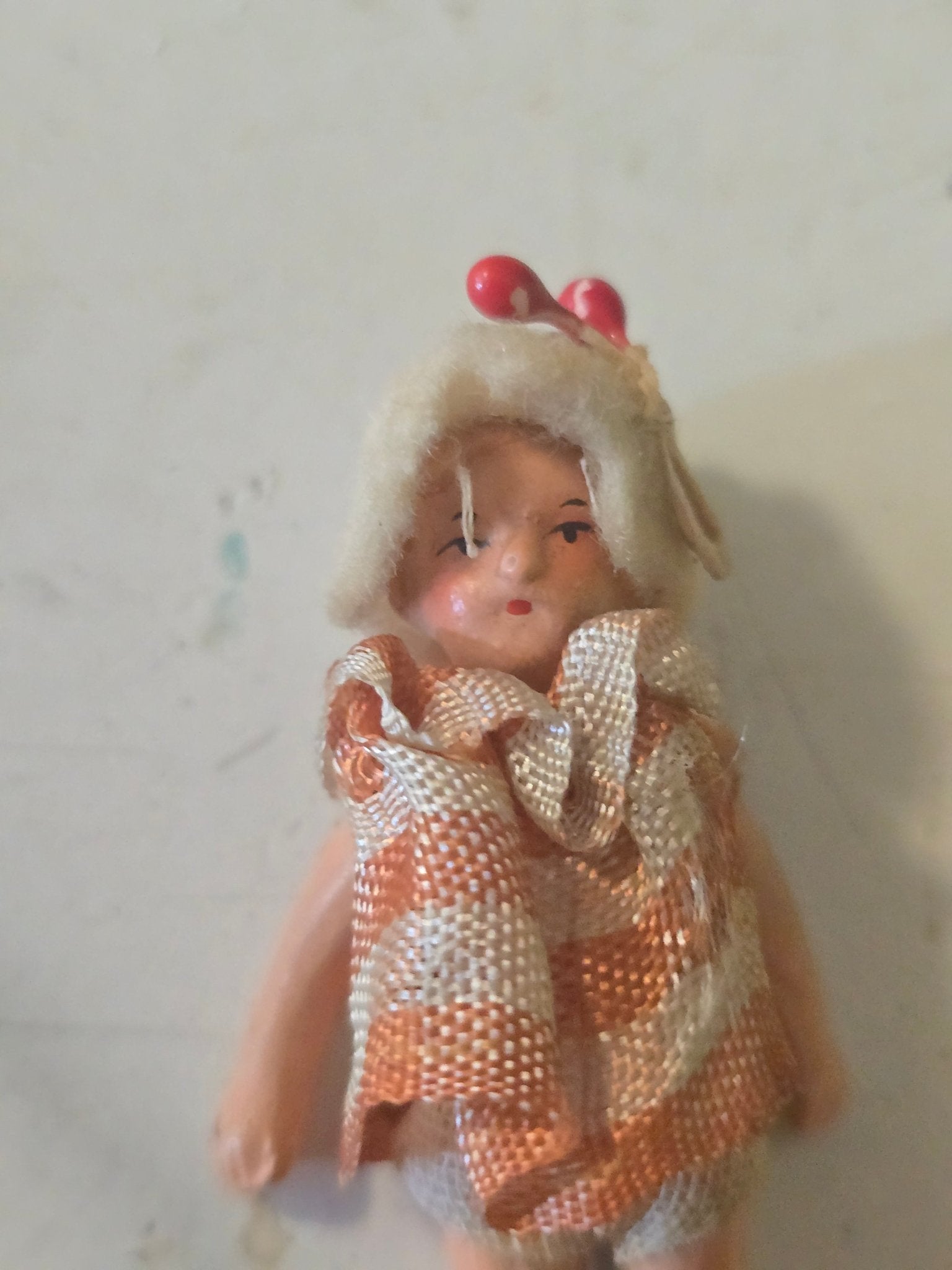 Antique 2.5" Miniature Jointed Doll – Hand Painted Metal/Hard Plastic – Original Dress & Hat w/ Berry - Bayshore Treasures