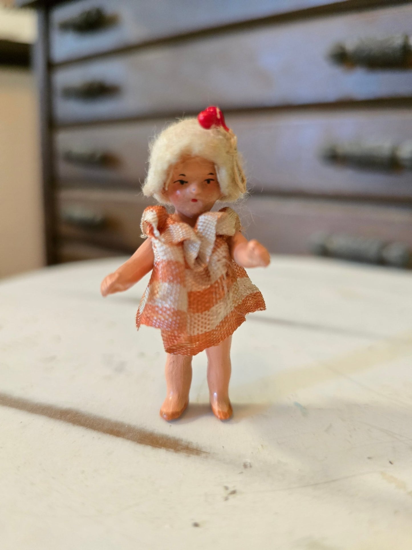 Antique 2.5" Miniature Jointed Doll – Hand Painted Metal/Hard Plastic – Original Dress & Hat w/ Berry - Bayshore Treasures